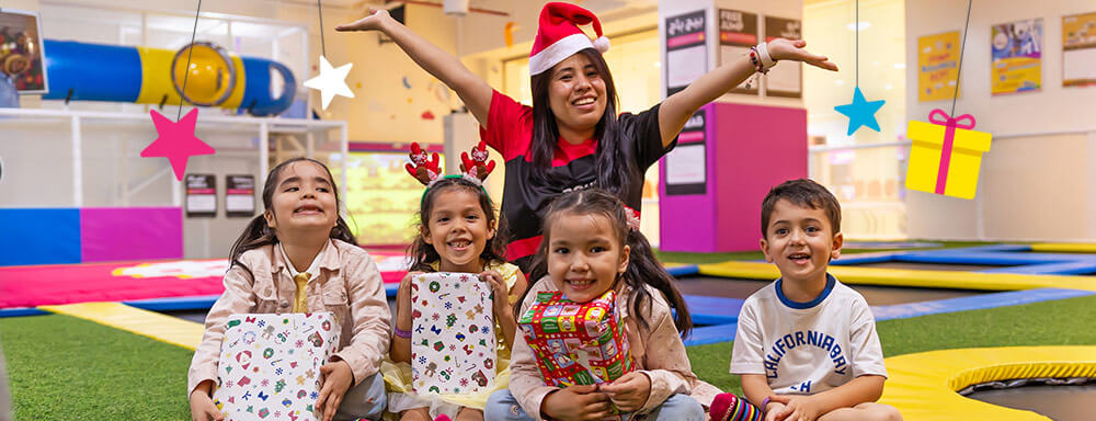 children receiving gifts at minibounce 12 Days of Giveaways