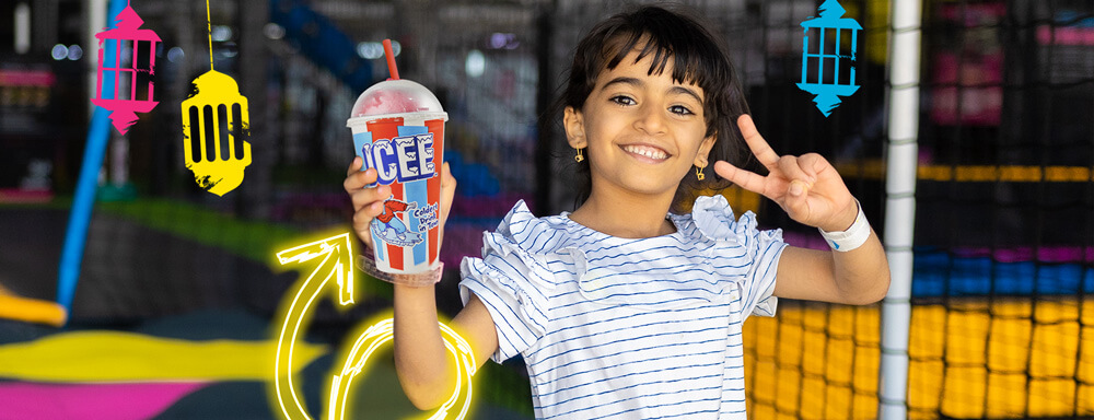 girl holding ICEE at bounce