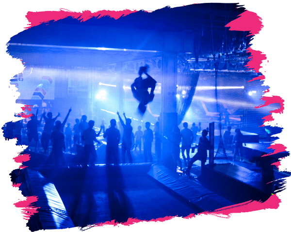 guy jumping on the trampoline doing a flip and people dancing in the background during bounce unfiltered